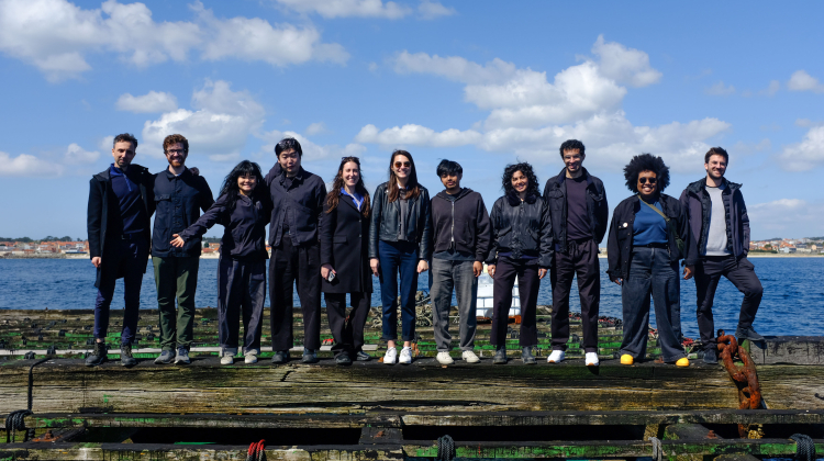 group of men and women on raft in ocean