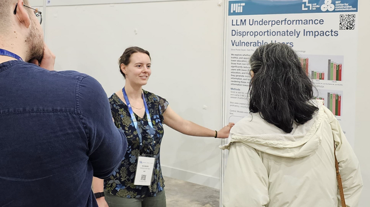 woman showing research poster