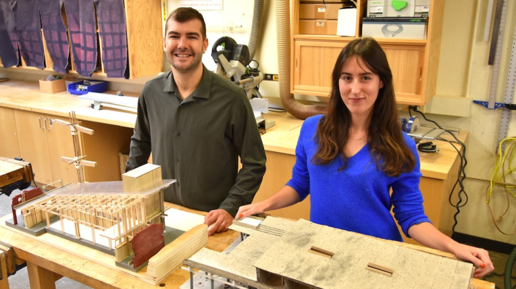 man and woman with building models they made