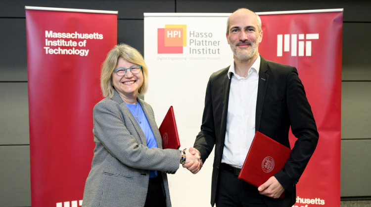 Sally Kornbluth, Tobias Friedrich shaking hands