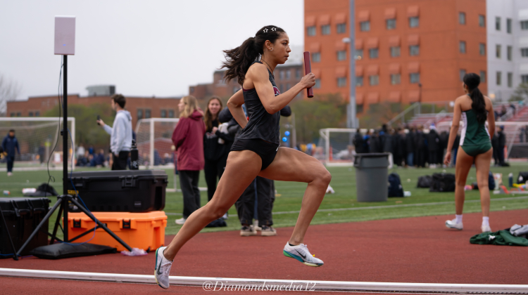 woman running on outdoor track