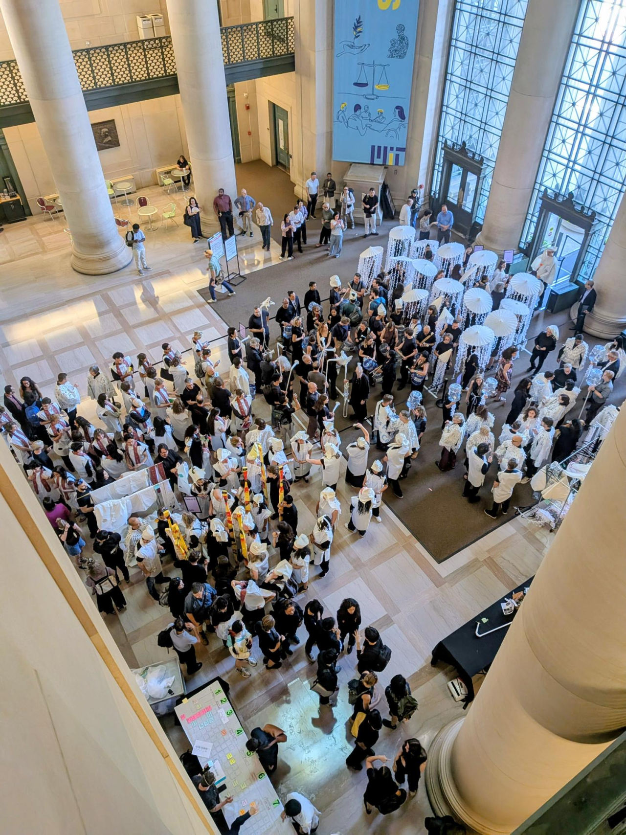 Overhead view of MIT School of Architecture and Planning community members gathered in Lobby 7 for the start of the Living Bucentaur procession to the MET Warehouse.