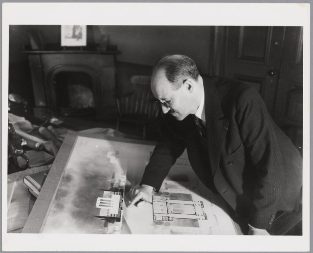 Photograph of William Emerson analyzing a student's architectural sketch.